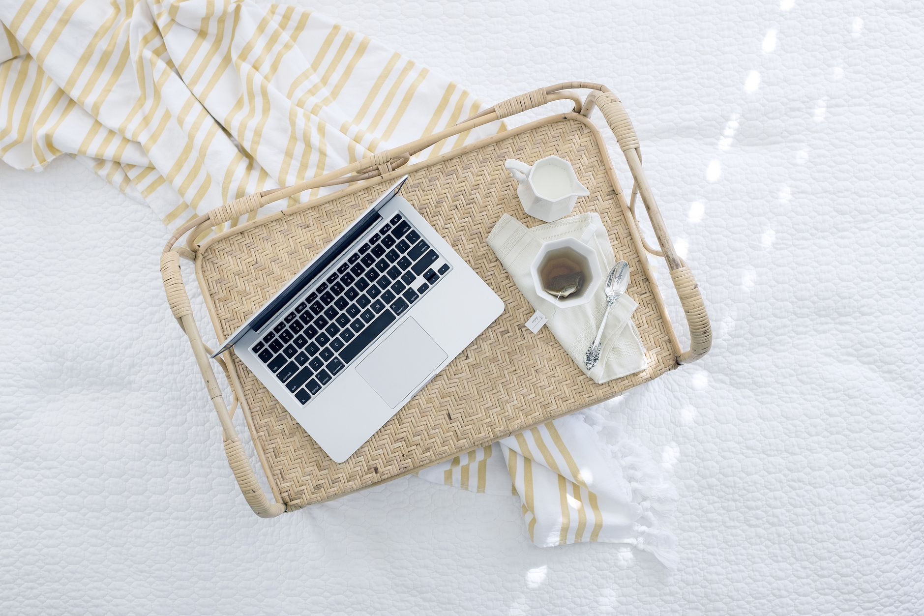 Laptop on Beige Wicker Chair